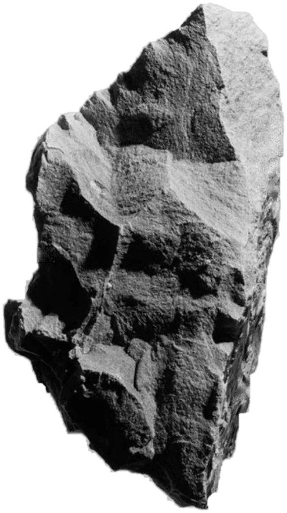 A fractured ore specimen, photographed in black and white